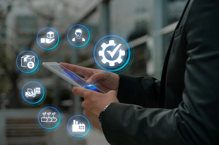 Business professional using a tablet with ERP service icons, showing how an Odoo service provider in Malaysia supports implementation, customization, integration, migration, consulting, and maintenance.