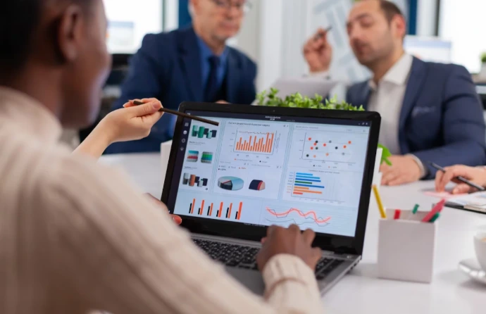 Odoo Partner Malaysia with Expert Odoo Implementation Support Team reviewing business performance dashboards in a meeting, showing how an experienced Odoo partner Malaysia and Odoo service provider helps businesses plan better Odoo implementation and solve system challenges.