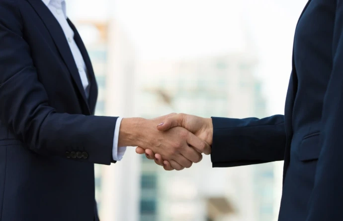 Long-Term Odoo Support from a Trusted Odoo Partner Malaysia Business professionals shaking hands, representing a long-term partnership with an Odoo partner Malaysia that provides ongoing Odoo Malaysia support, upgrades, and dependable Odoo service provider assistance as businesses grow.