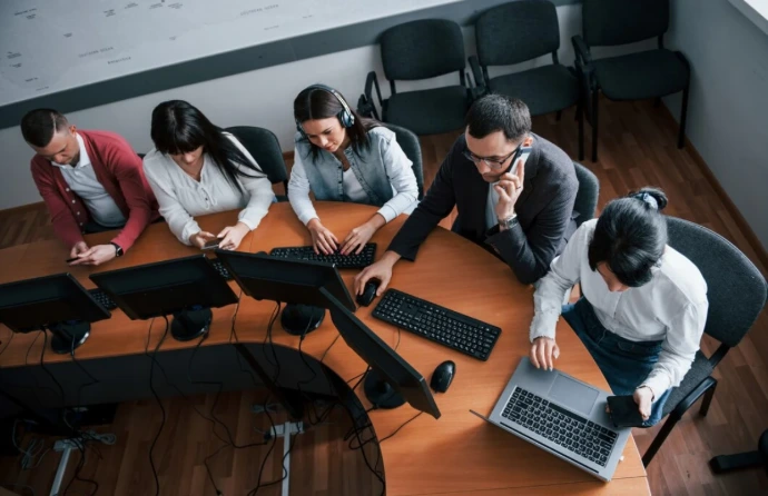 Professional team working together representing Odoo implementation services and Odoo ERP implementation by experienced consultants and developers.